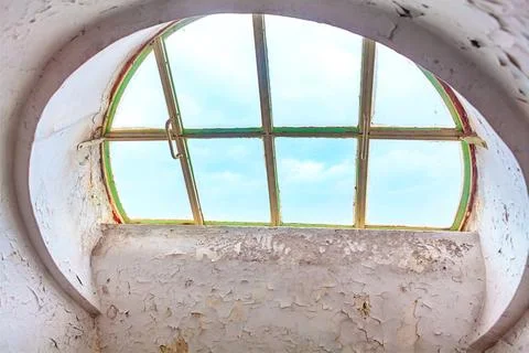 Weathered circular window with peeling white paint Stock Photos