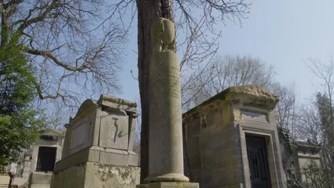 Weathered Column Tomb at Pere Lachaise Cemetery in Paris Tilt Up Shot Stock Footage 337664551