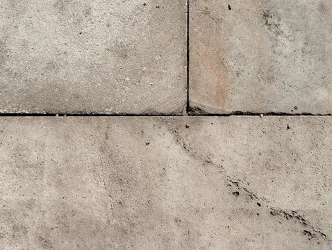 Weathered Concrete Pavement Texture with Cracks and Geometric Patterns Stock Photos