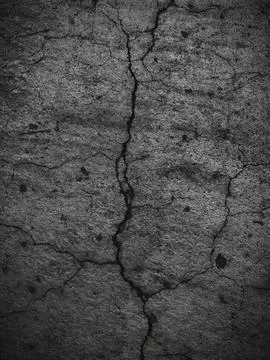 Weathered concrete wall texture with gray worn surface and deep vertical crac Stock-Fotos