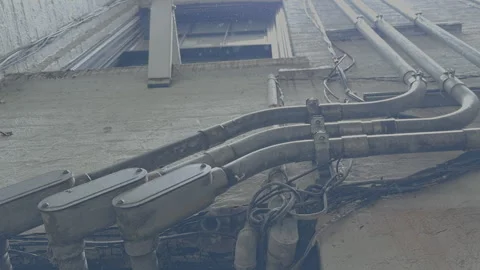Weathered Electrical Wiring Conduits Dripping in Light Rain Vidéo 330669338