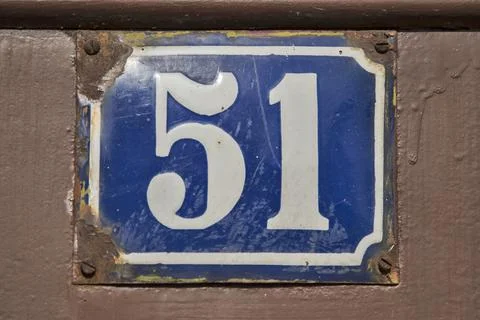 Weathered enameled plate number 51 Stock Photos