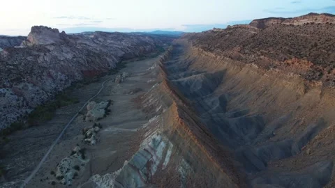 Weathered Eroded Mountains In Deserts Of Utah Near Old Paria Vermillion Video stock 237453542