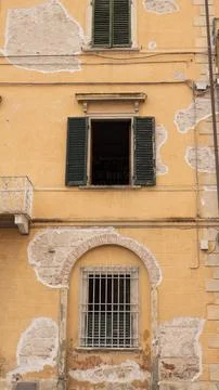 The weathered faade of a typical old Italian building Stock Photos