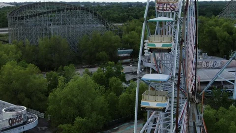 Weathered Ferris wheel gondolas above the New Orleans midway Stock-Footage 111650543