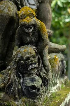 Weathered Figurative Temple Carving in Ubud Stock Photos