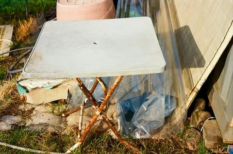 Weathered Folding Table in a Rural Backyard Stock Photos
