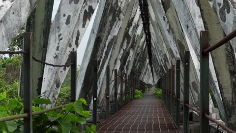 Weathered geometric concrete bridge interior with symmetrical pedestrian walkway Vídeo Stock 337928389