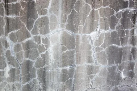 Weathered gray wall with cracks Stock Photos