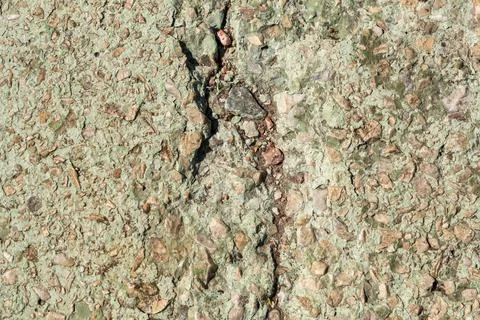Weathered Green Concrete Texture with Deep Surface Crack Stock Photos