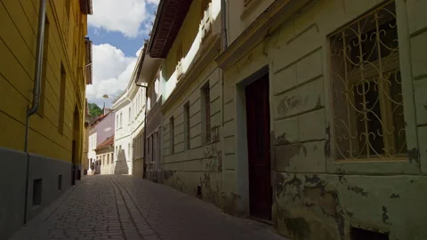 Weathered Green Facade Along Cobbled Brasov Alley Stock Footage 348236013