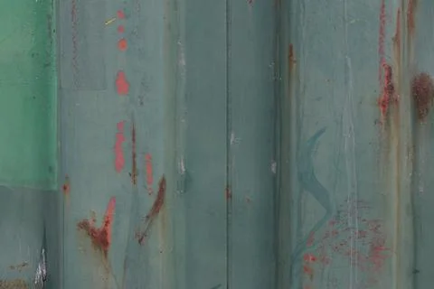 Weathered green metal texture with rust and peeling paint Stock Photos