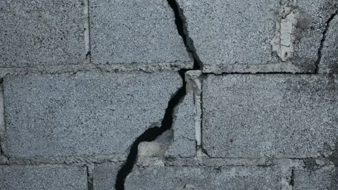 Weathered Grey Concrete Block Wall Large Diagonal Crack Stock Footage 338371494