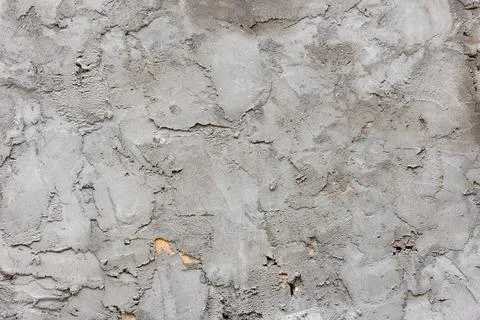 Weathered grey wall with texture and damage outdoors Фото
