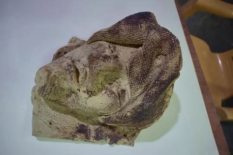 Weathered handmade sculpted face in close-up Stock Photos