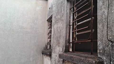 Weathered industrial building windows with rust in motion video footage Vídeos de archivo 339505172