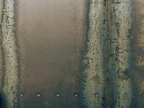 Weathered industrial metal sheet with rustic patches, oxidation, and visibl.. Stock Photos