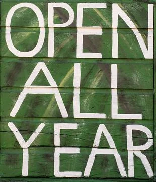 Weathered large sign Open All Year Stock Photos