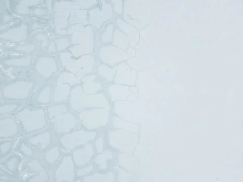 Weathered Light Blue Plaster Wall Texture with Cracked Pattern Foto stock