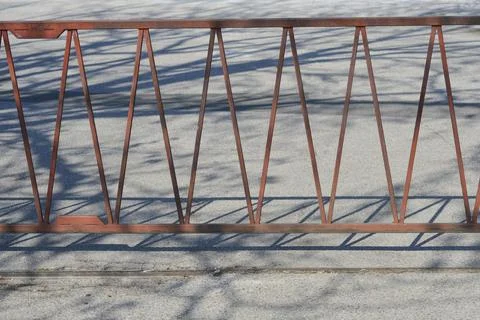 Weathered metal fence with triangular pattern. Fotos de archivo