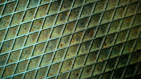 Weathered metal grid with rusted texture in shades of green and brown, perf.. Stock-Illustration