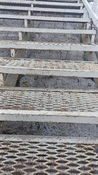 Weathered Metal Staircase with Geometric Pattern Texture for Industrial Cre.. Foto stock