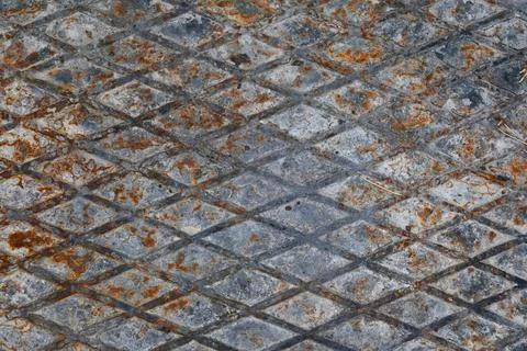Weathered metal surface with diamond pattern Stock Photos
