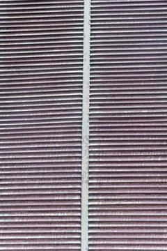 Weathered Metal Vent Texture Background with Repetitive Industrial Pattern Stock Photos