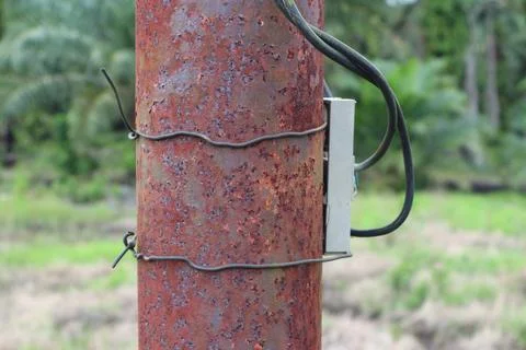 Weathered metallic cylindrical post texture, aged and rustic outdoor object Stock Photos