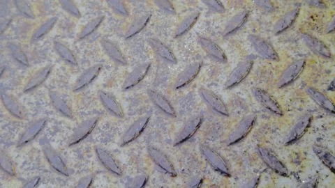 Weathered Metallic Surface with Fine Scratches and Industrial Debris on Diamond Stock Footage 328645557