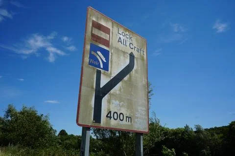 Weathered Navigation Sign For Lock And Weir In Nottinghamshire, England. Stock Photos
