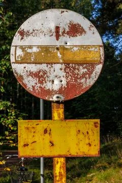 Weathered no entry sign on forest road near Hamina, Finland. Stock Photos