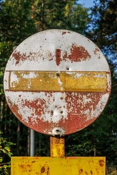 Weathered no entry sign on forest road near Hamina, Finland. Stock Photos