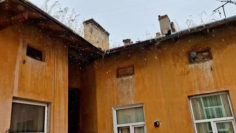 Weathered Old Building with Chimneys in Light Rain Stock Footage 341656406
