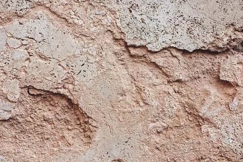 Weathered old stone wall background - cracked limestone texture Stock Photos