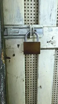 Weathered Padlock on Rustic Door Stock Photos
