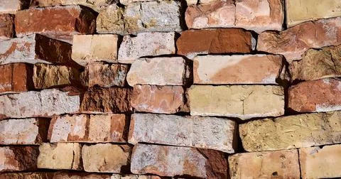 Weathered painted old brick wall background. Brickwork paint. Stock Photos