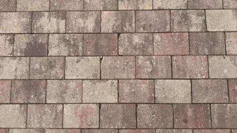 Weathered paving stones in staggered brick pattern Vídeo Stock 344041693
