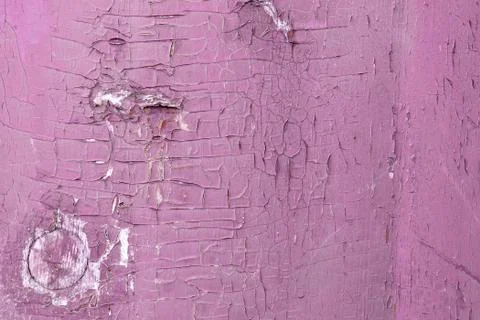 Weathered pink colored paint on rustic wooden panel Stock Photos