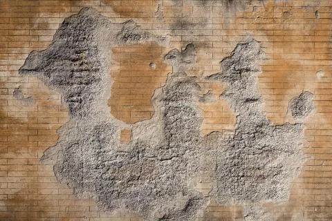 Weathered plaster and brick wall textured background Stock Photos