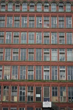 Weathered Red Brick Building With Broken Windows, Belper, Derbyshire, England Stock Photos