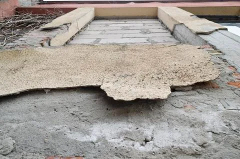 Weathered red brick wall background with spots Stock Photos