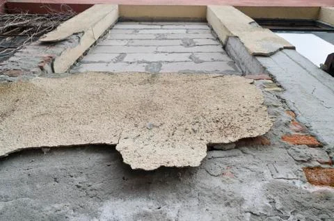 Weathered red brick wall background with spots Stock Photos