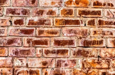 Weathered red brick wall as background texture Stock Photos
