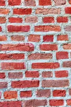 Weathered red brick wall as background Stock Photos