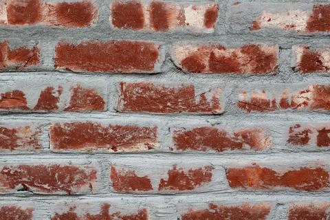 Weathered Red Brick Wall with Grey Mortar Texture Stock Photos