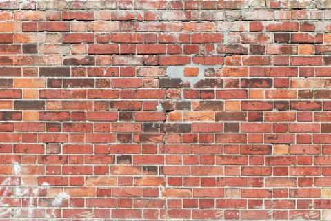 Weathered red brick wall 스톡 사진