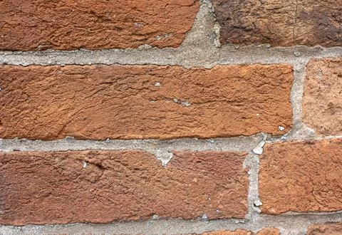 Weathered red brick wall texture with detailed mortar joints Stock Photos