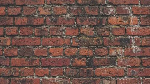 Weathered Red Brick Wall Texture Background Close Up. Fotos Stock