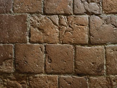 Weathered red brick wall texture with rough chipped mortar, warm rust beige.. Stock Photos